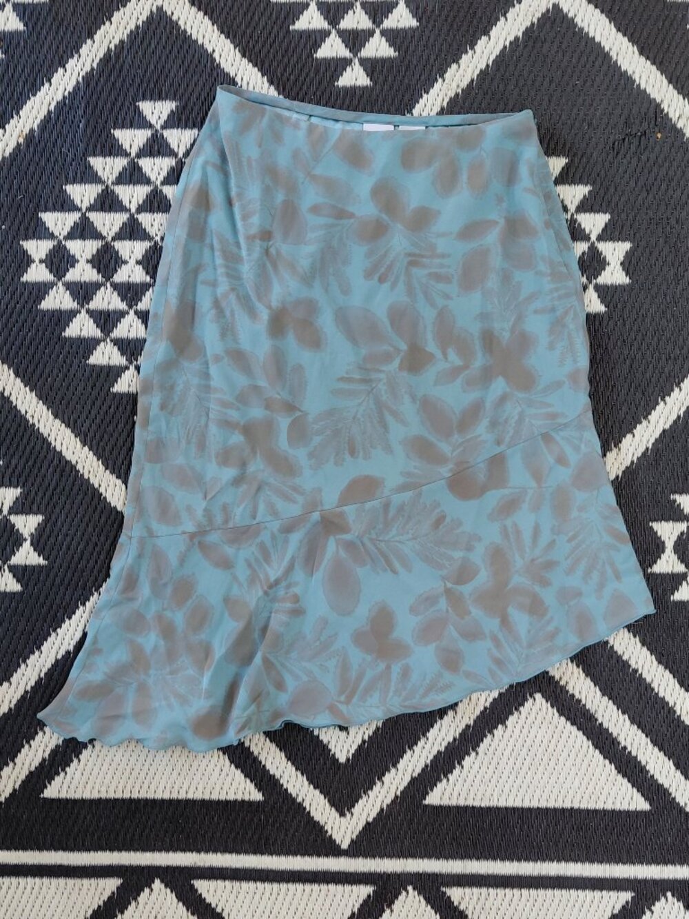 Armani Exchange - blue asymmetrical skirt - features a subtle gray leaf patte